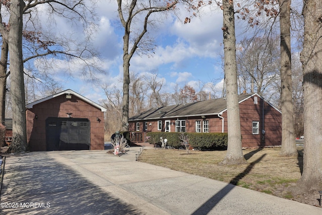 single story home with a garage and a deck