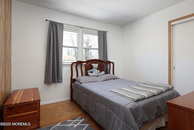 bedroom with hardwood / wood-style flooring