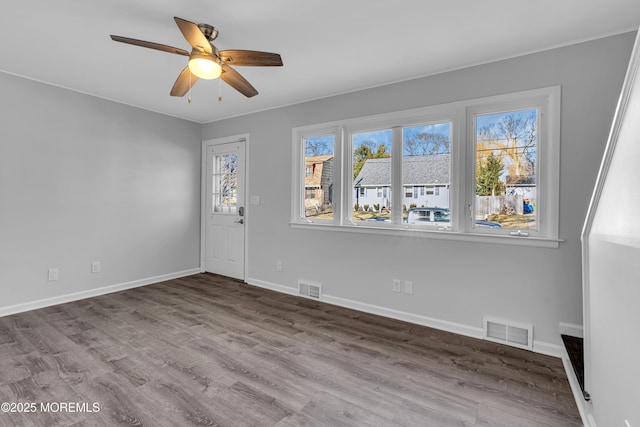 unfurnished room with wood-type flooring and ceiling fan