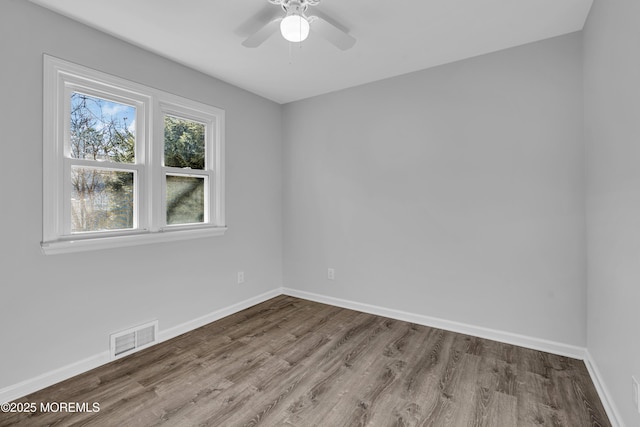 unfurnished room with ceiling fan and hardwood / wood-style floors