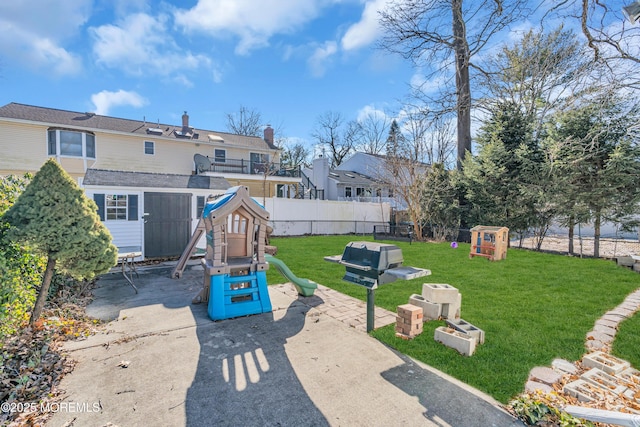 exterior space featuring a lawn and a patio area