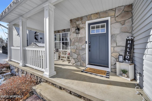 doorway to property featuring a porch