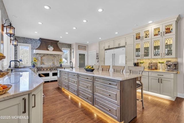 9 Mehar Ct, Jackson, NJ 08527 - kitchen with a breakfast bar, high end appliances, premium range hood, recessed lighting, and decorative backsplash