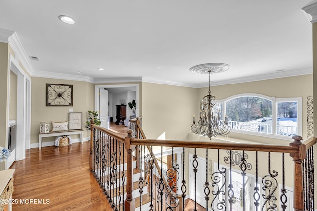 9 Mehar Ct, Jackson, NJ 08527 - hallway featuring a chandelier, an upstairs landing, light wood finished floors, recessed lighting, and crown molding