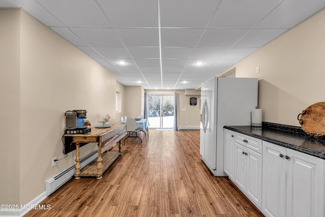 9 Mehar Ct, Jackson, NJ 08527 - kitchen with light wood finished floors, white cabinetry, a drop ceiling, white refrigerator with ice dispenser, and recessed lighting