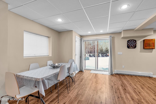 9 Mehar Ct, Jackson, NJ 08527 - dining room featuring a baseboard radiator, light wood-style floors, recessed lighting, a paneled ceiling, and baseboards