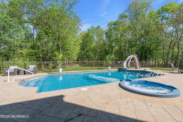 9 Mehar Ct, Jackson, NJ 08527 - view of swimming pool featuring a water slide, a patio area, an in-ground hot tub, and a fenced backyard