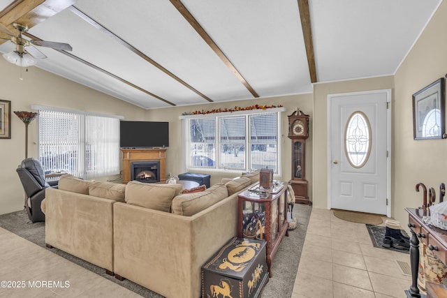 tiled living room featuring vaulted ceiling with beams