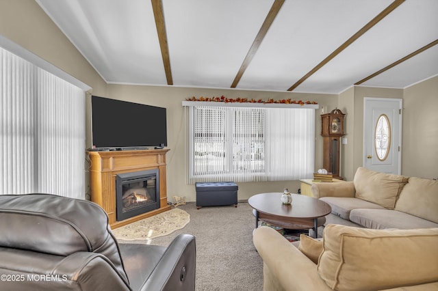 living room with vaulted ceiling with beams, plenty of natural light, and carpet flooring