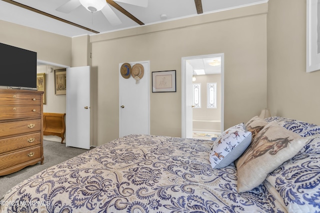 carpeted bedroom with ceiling fan and ensuite bath