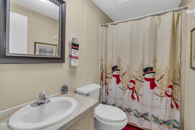 bathroom featuring vanity, curtained shower, and toilet