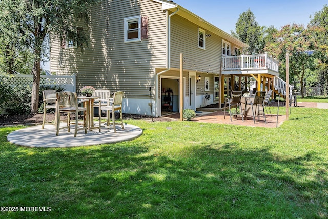 back of house featuring a patio, stairs, fence, a deck, and a yard