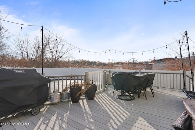 wooden deck with grilling area