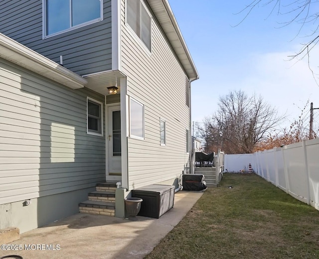 view of home's exterior featuring a yard