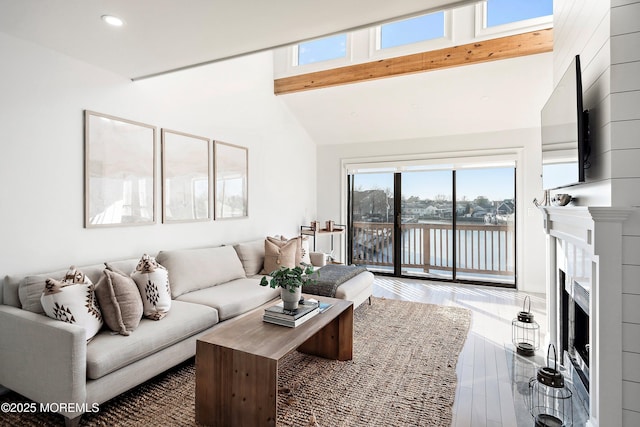 living room featuring vaulted ceiling with beams