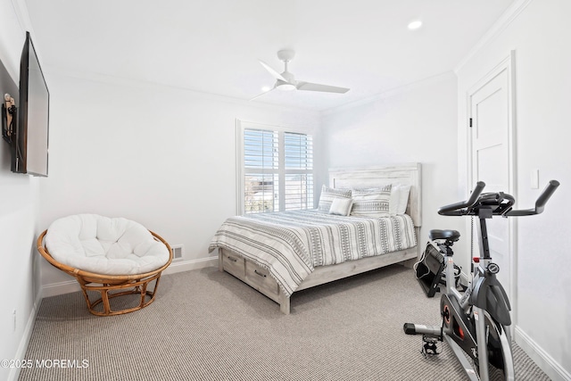 carpeted bedroom featuring ornamental molding and ceiling fan