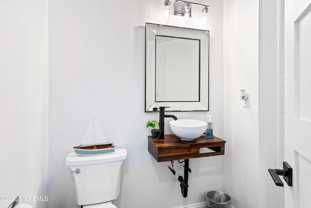 bathroom with sink and toilet