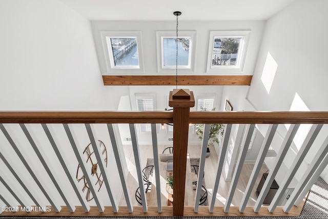 staircase featuring a high ceiling