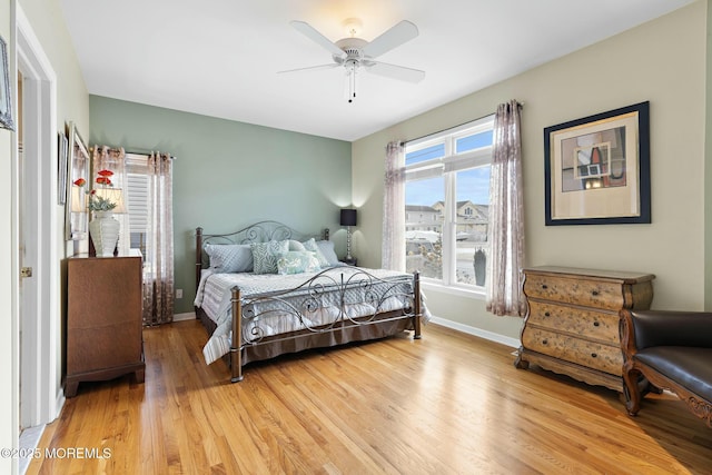 bedroom featuring hardwood / wood-style flooring and ceiling fan