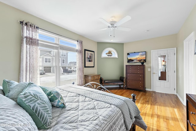 bedroom with wood-type flooring and ceiling fan