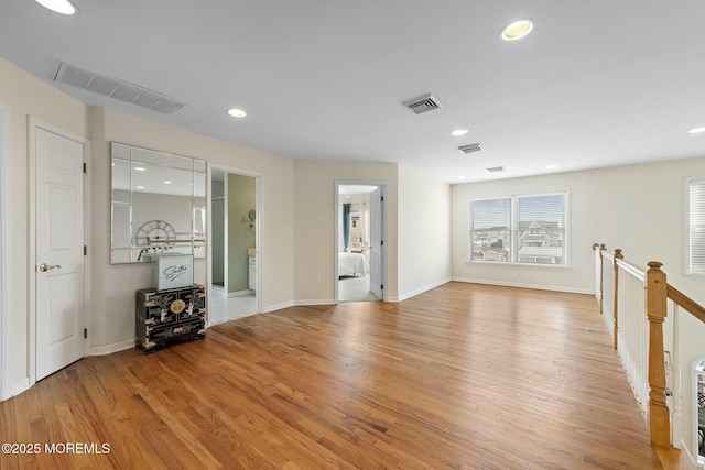 unfurnished living room featuring light hardwood / wood-style floors