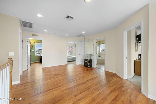 unfurnished living room with light hardwood / wood-style flooring