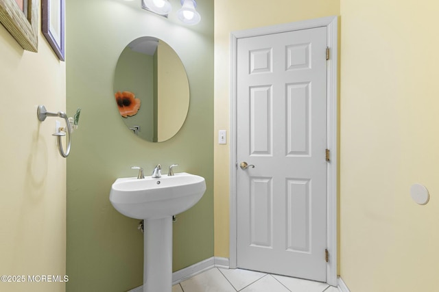 bathroom featuring tile patterned flooring and sink