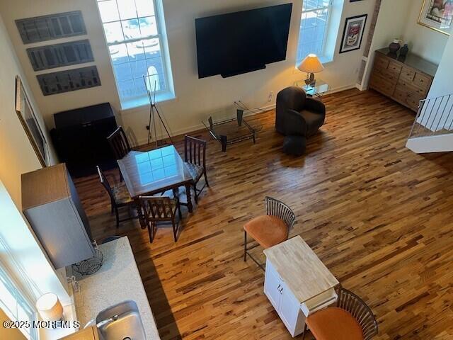 living room featuring baseboards and wood finished floors