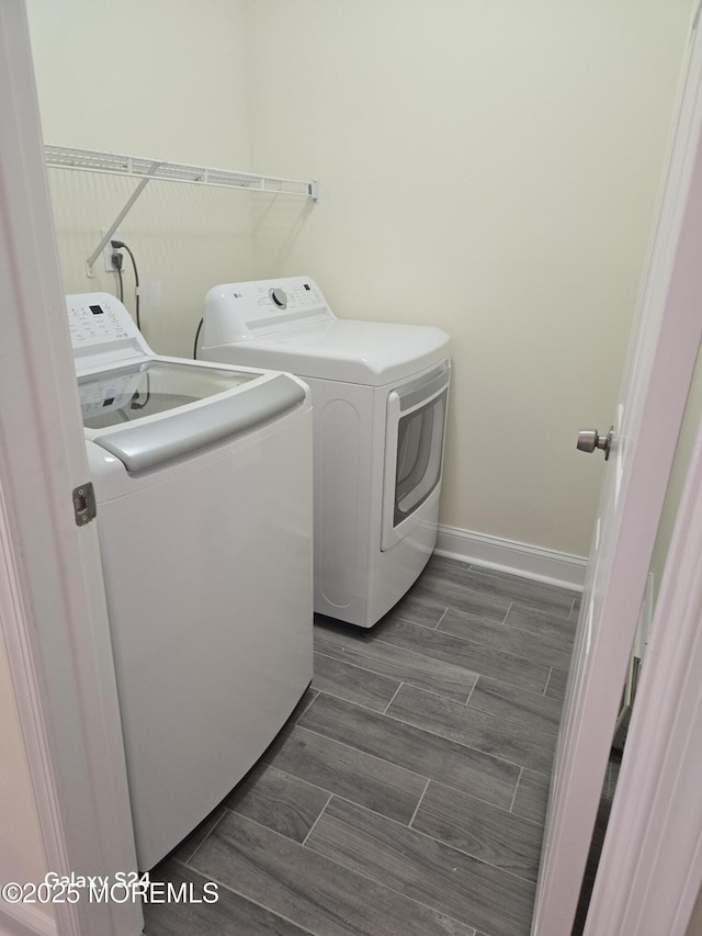 laundry area featuring washing machine and clothes dryer