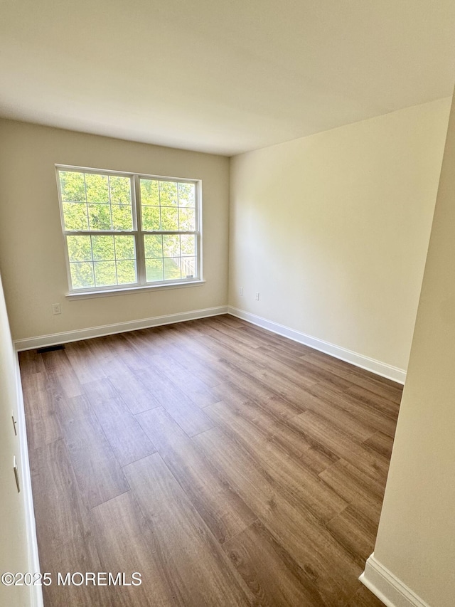 327 Daniele Dr, Ocean Twp, NJ 07712 - empty room with dark wood-style floors and baseboards