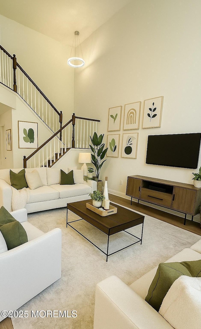 327 Daniele Dr, Ocean Twp, NJ 07712 - living room featuring stairs and a high ceiling