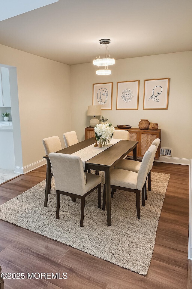 327 Daniele Dr, Ocean Twp, NJ 07712 - dining space featuring wood finished floors and a chandelier