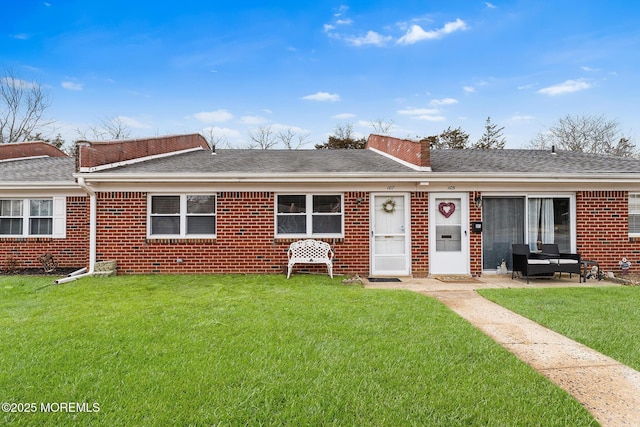 ranch-style house with a front lawn