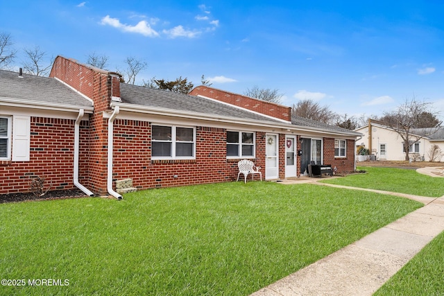 back of house with a yard