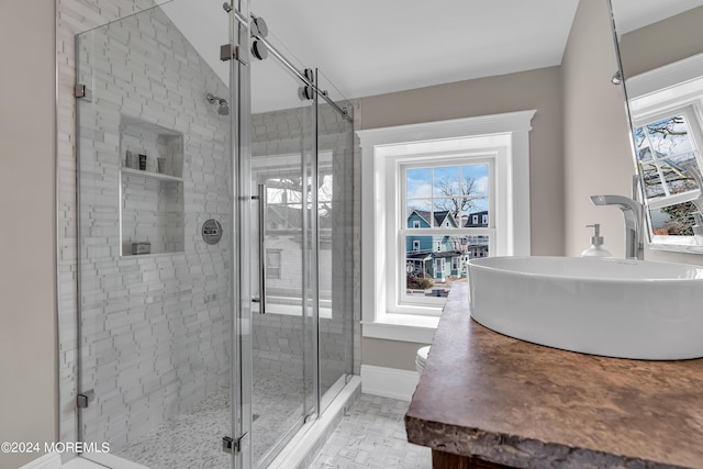 bathroom featuring vanity and walk in shower