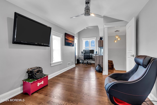 living area with hardwood / wood-style floors, vaulted ceiling, and ceiling fan