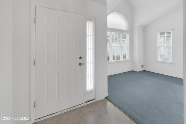 foyer featuring carpet