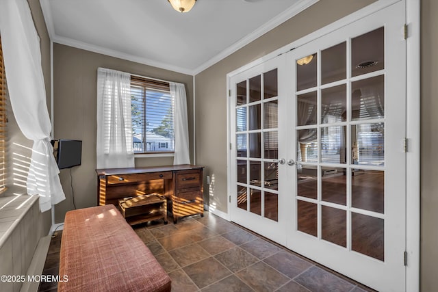 interior space with ornamental molding and french doors