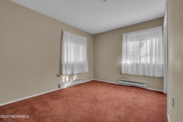 carpeted empty room featuring a baseboard heating unit