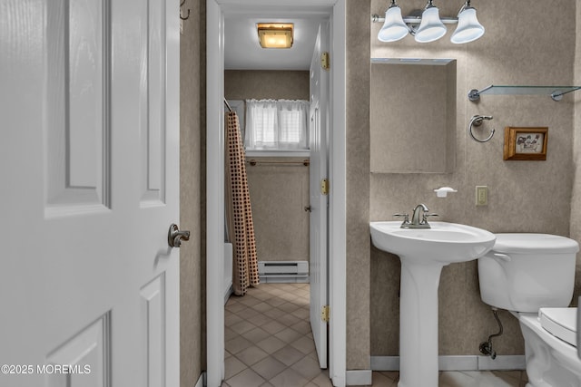 bathroom featuring tile patterned floors, toilet, sink, a shower with curtain, and a baseboard radiator