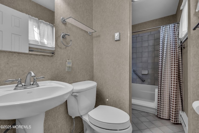 full bathroom with tile patterned floors, toilet, sink, shower / bath combo, and a baseboard heating unit