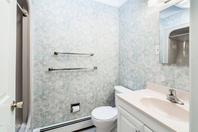 bathroom with a baseboard radiator, vanity, and toilet