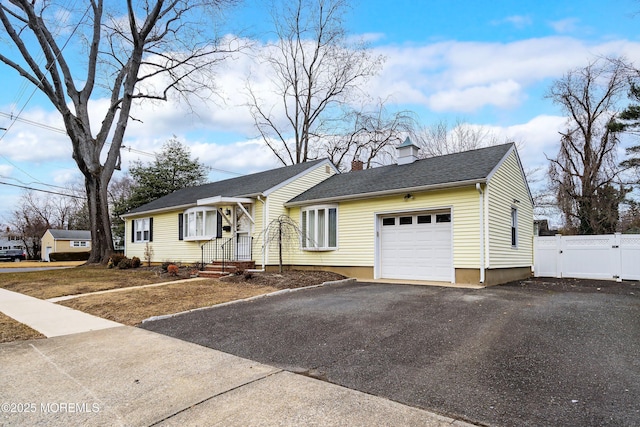 single story home featuring a garage