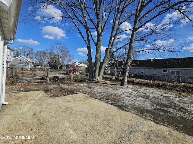 view of yard with a patio area and a playground