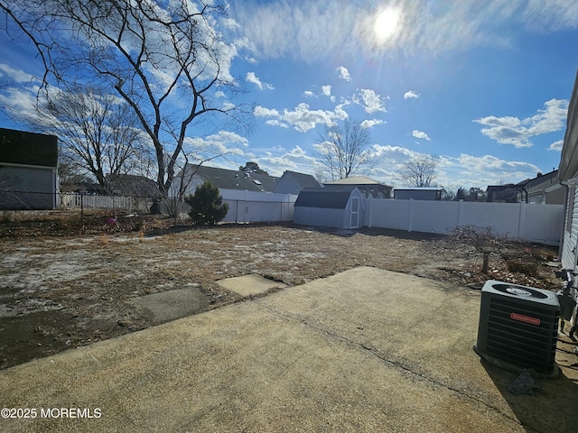 view of yard with central air condition unit