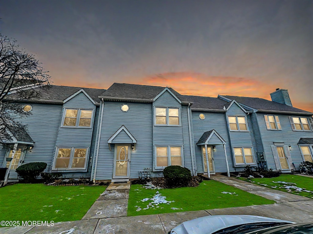 view of property with a lawn