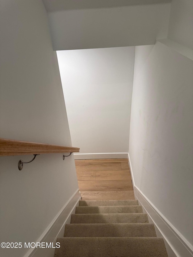 stairway with wood-type flooring