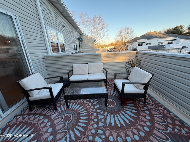 patio terrace at dusk featuring an outdoor hangout area