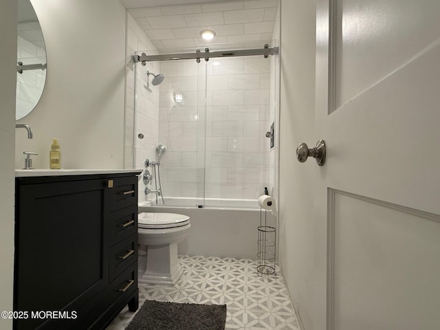 full bathroom featuring vanity, toilet, and bath / shower combo with glass door