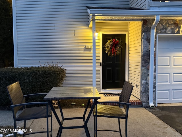 view of exterior entry with a garage